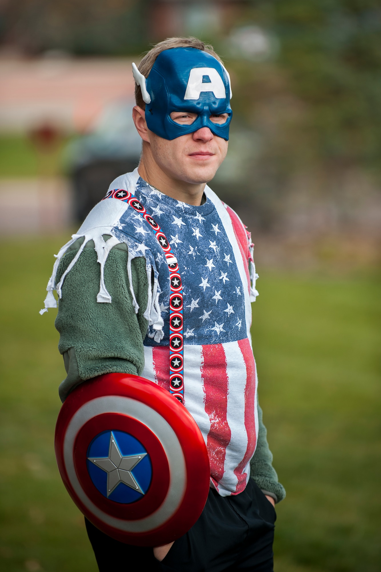 PETERSON AIR FORCE BASE, Colo. - Senior Airman Joshua Kennedy, 21st Medical Operations Squadron, dressed up as Captain America and stands guard to defend Peterson Air Force Base and participate in the 21st Space Wing Warfit fun run Oct. 30, 2015. The 5K run started at The Club and followed a trail around the golf course and finished back at The Club. Participants also had the opportunity to take part in the Final Friday activities after the run. (U.S. Air Force photo by Craig Denton)