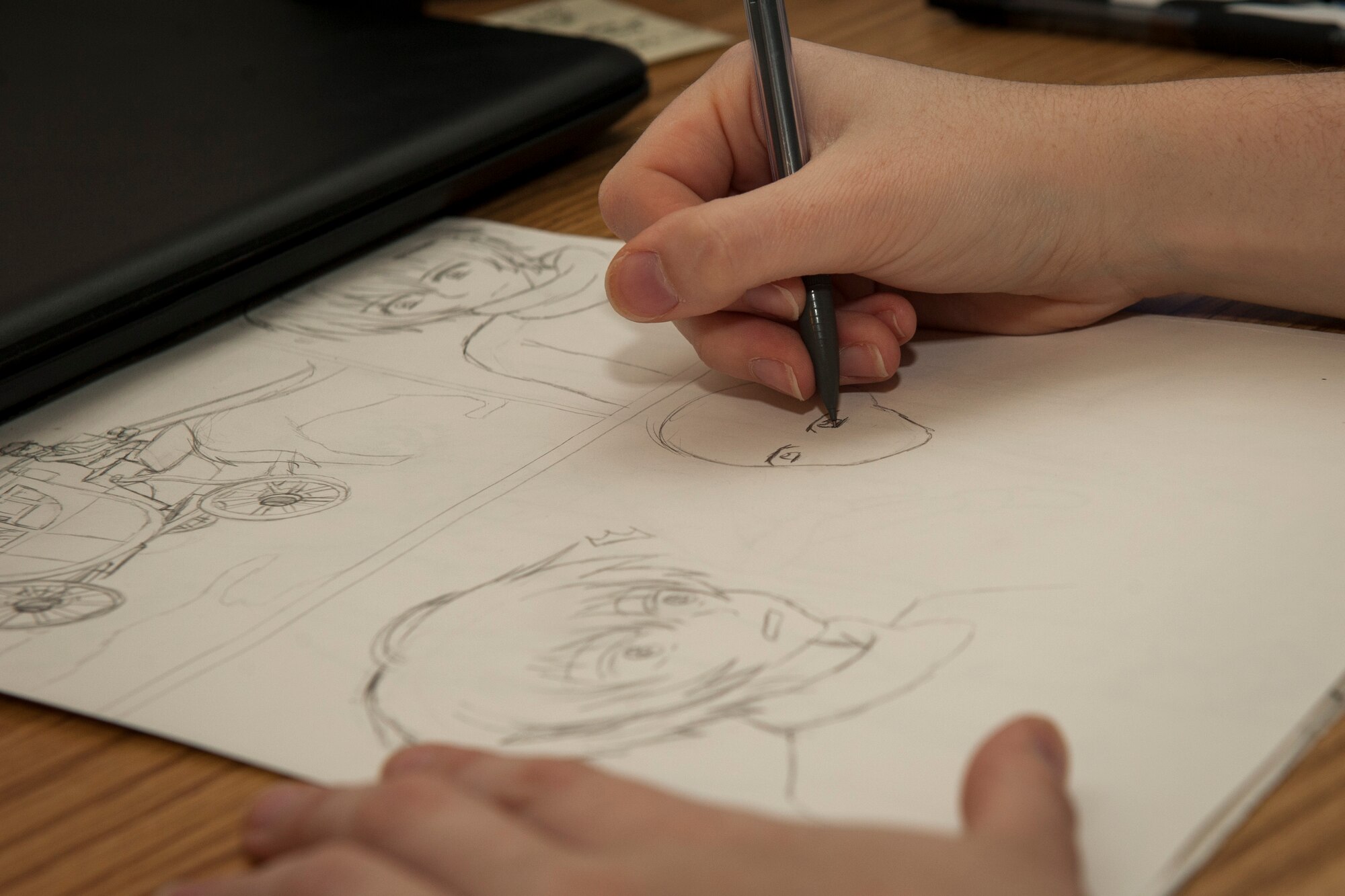 PETERSON AIR FORCE BASE, Colo. – Airman 1st Class Abby Morris, 21st Operations Support Squadron airfield management apprentice, works on a manga story during her off-time in her dorm Nov. 2, 2015. Morris began drawing at the age of 8 years old and got into anime and manga after seeing a couple Japanese anime shows. (U.S. Air Force photo by Senior Airman Rose Gudex)