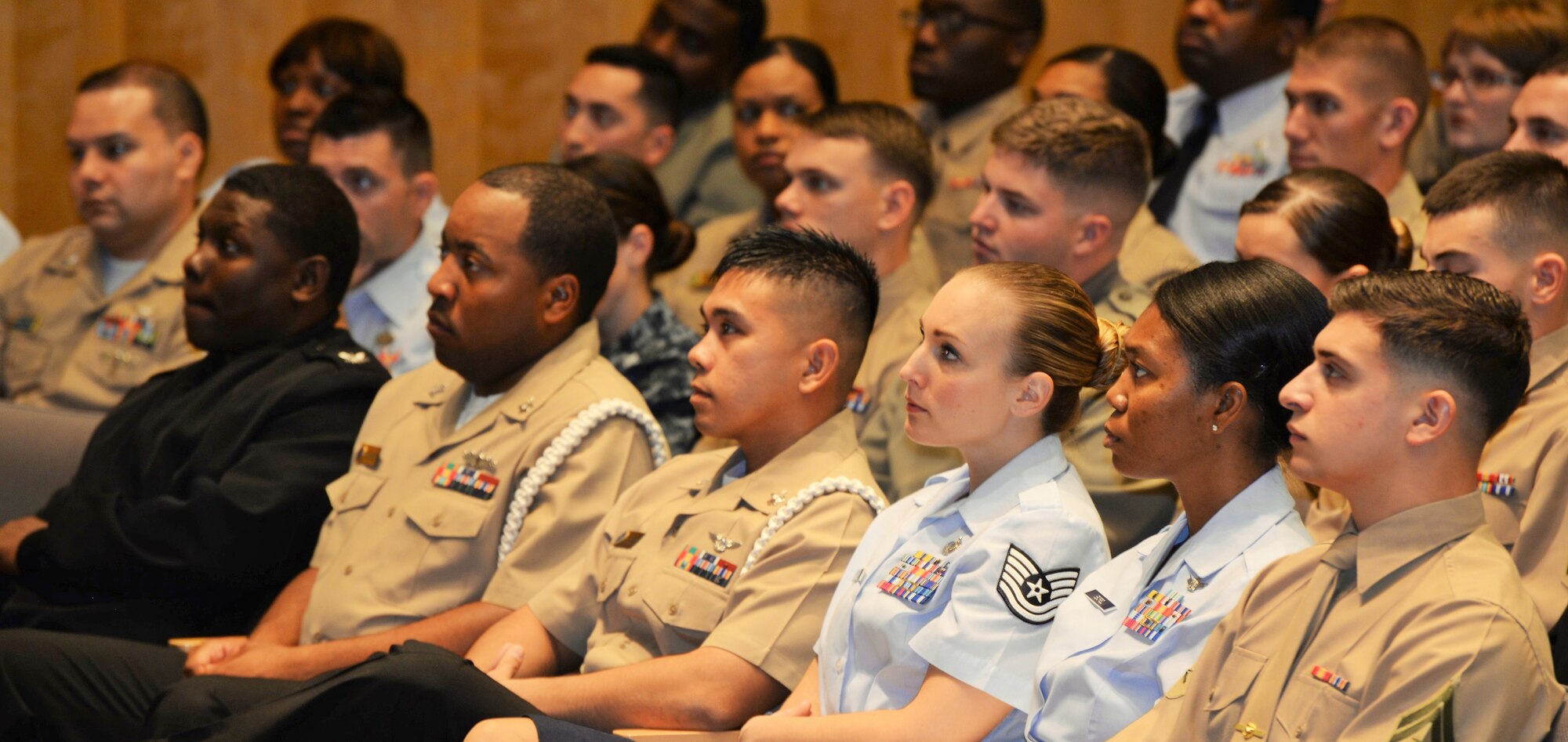 Participants in the Joint Professional Development Seminar listen to the Senior Enlisted Advisor to the Chairman of the Joint Chiefs of Staff on Nov. 2, 2015 at the National Defense University. The session was one of many to happen during the five-day course designed to engage Noncommissioned and Petty Officers in deliberate development to equip them to lead through the challenges of the 21st century. (U.S. Air Force photo/1Lt. Esther Willett)