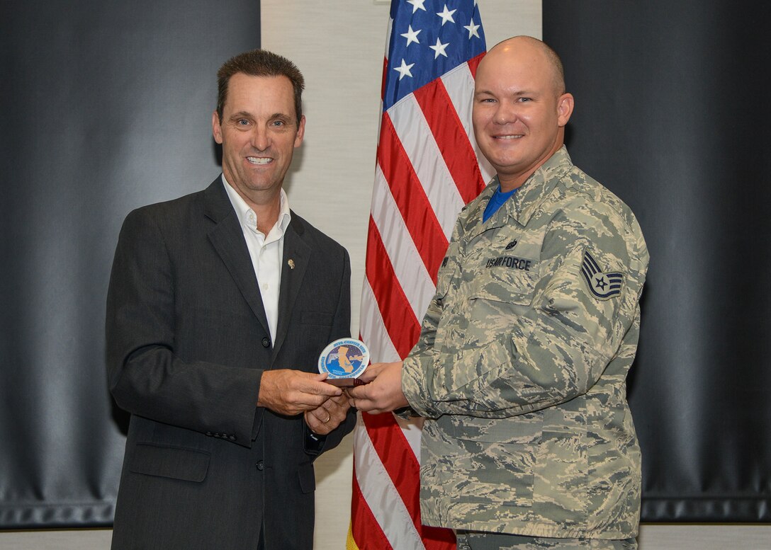 Staff Sgt. Michael Burd, Air Force Sergeants Association Chapter 1338 president, presents U.S. Congressman Steve Knight with an AFSA Chapter 1338 patch, thanking him for coming and speaking at their sponsored event Oct. 30 at the Airmen and Family Readiness Center. (U.S. Air Force photo by Rebecca Amber)