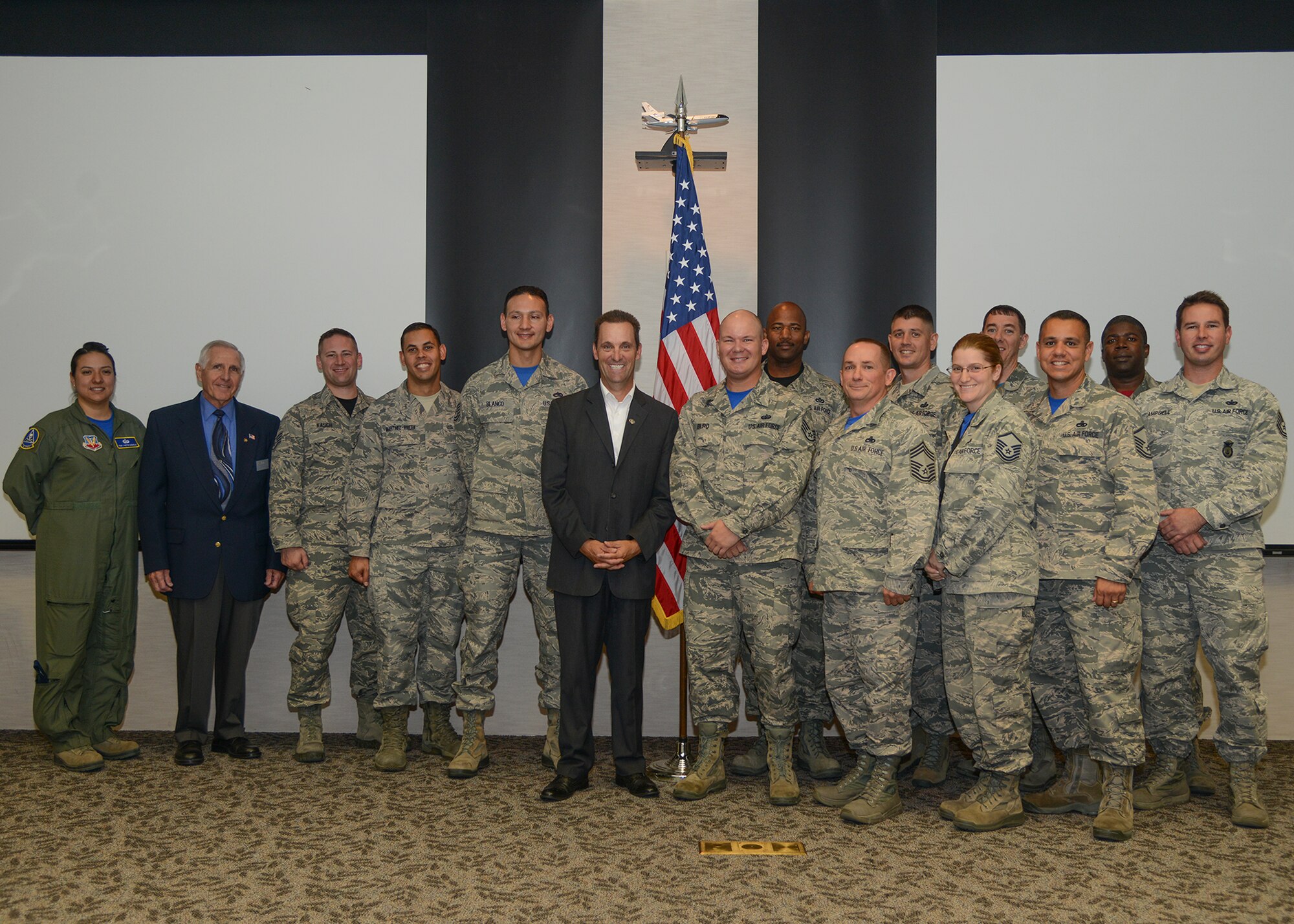 Congressman Steve Knight (center) poses for a photo with attendees of an Air Force Sergeants Association meeting Oct. 30 at Club Muroc. Knight spoke about the legislative processes that happen in Congress and how lobby groups such as AFSA always need to be communicating their concerns with lawmakers and politicians to ensure their voices are heard. (U.S. Air Force photo by Rebecca Amber)