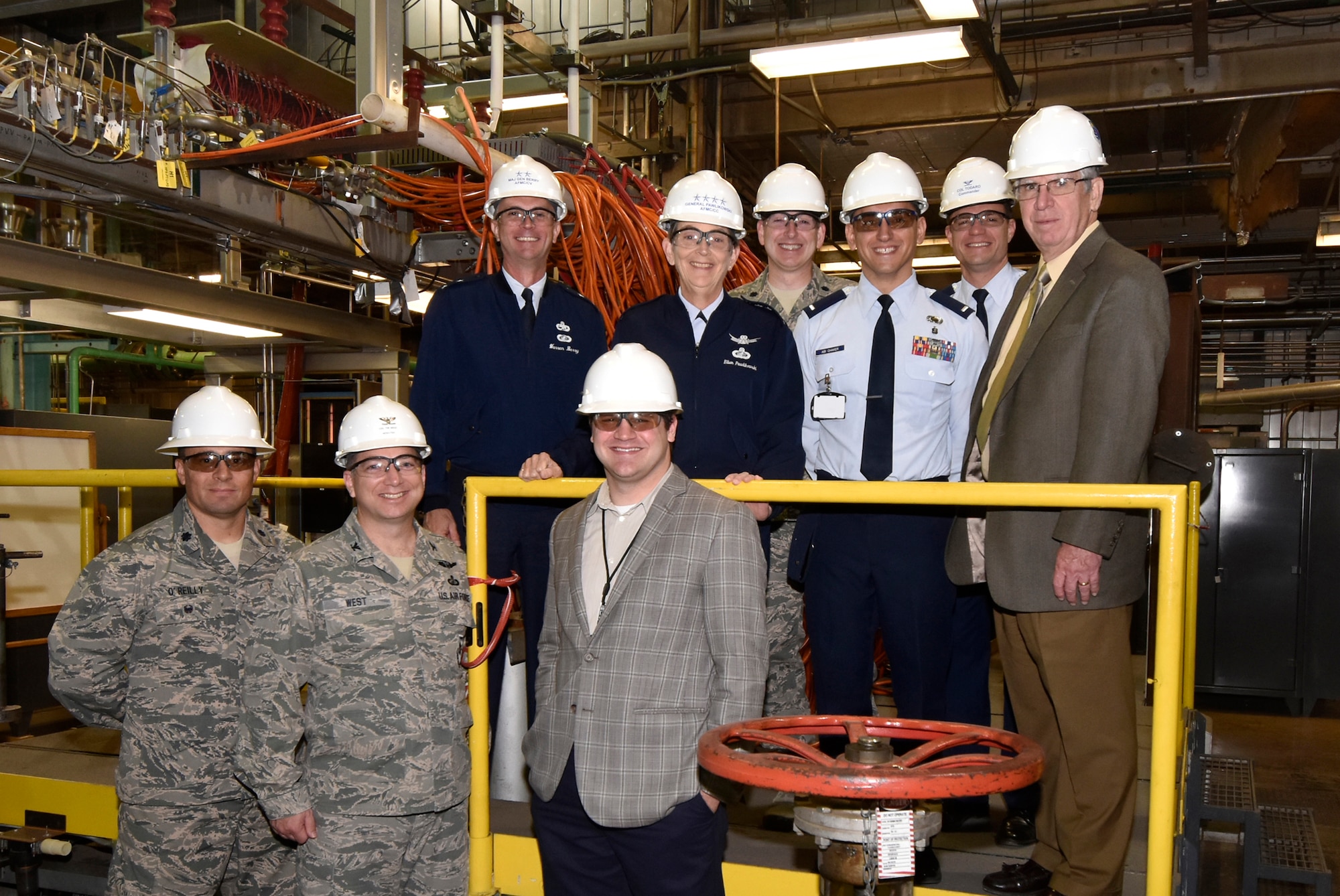 Gen. Ellen M. Pawlikowski (back row, second from left), commander of Air Force Materiel Command, pauses for a group photo while touring the AEDC Arc Heaters Test Facility Oct. 16, 2015. The facility provides high-enthalpy environments to test materials and thermal protection. Pictured in the front row from left is Lt. Col. Mark O’Reilly, AEDC Test System Sustainment Division Chief; Col. Timothy West, AEDC Test Operations Division Chief; Gary Hammock, Space and Missile Combined Test Force aerospace test engineer; back row from left: Maj. Gen. Warren D. Berry, AFMC vice commander; Pawlikowski; Lt. Col. Jason Armstrong, Space and Missile CTF director; 1st Lt. Zahi Abi Chaker, AEDC Command Executive Officer; Col. Rodney Todaro, commander of AEDC; and Dr. Edward Kraft, AEDC Chief Technologist. (U.S. Air Force photo/Jacqueline Cowan)