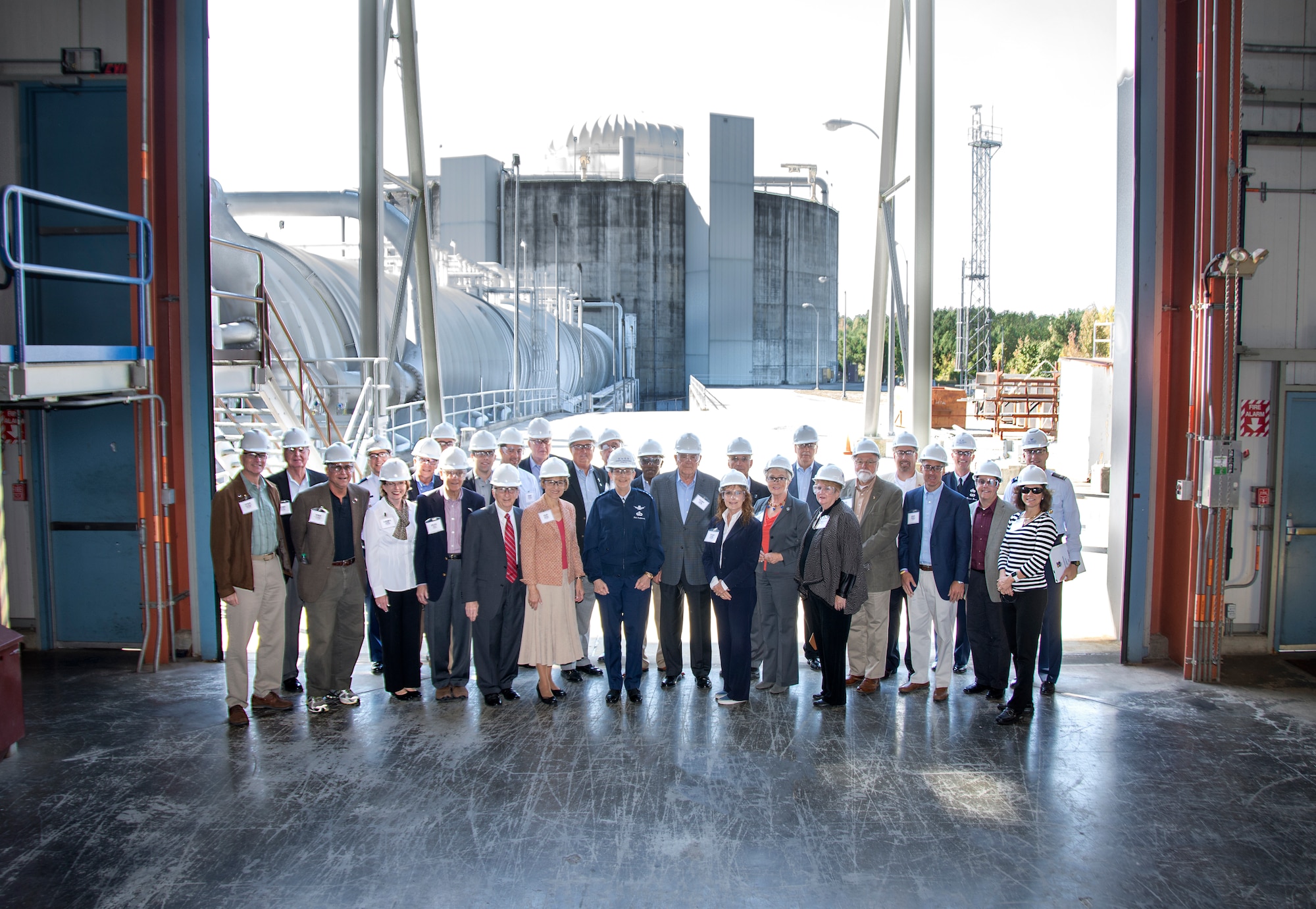 Gen. Ellen M. Pawlikowski, commander of Air Force Materiel Command, toured Arnold Air Force Base, Tenn., Oct. 15, 2015, with members of the AFMC Community Liaison Program. Hosted by Col. Rod Todaro, commander of the Arnold Engineering Development Complex, Pawlikowski and CLP members received briefings, toured facilities and exchanged ideas. The 24 attending members of the CLP group represent communities surrounding AFMC installations across the United States, and serve as a civilian interface between the Air Force and their respective civilian communities. The group is pictured at the J-6 Large Rocket Motor Test Facility High Bay. (U.S. Air Force photo/ Jackie Cowan)