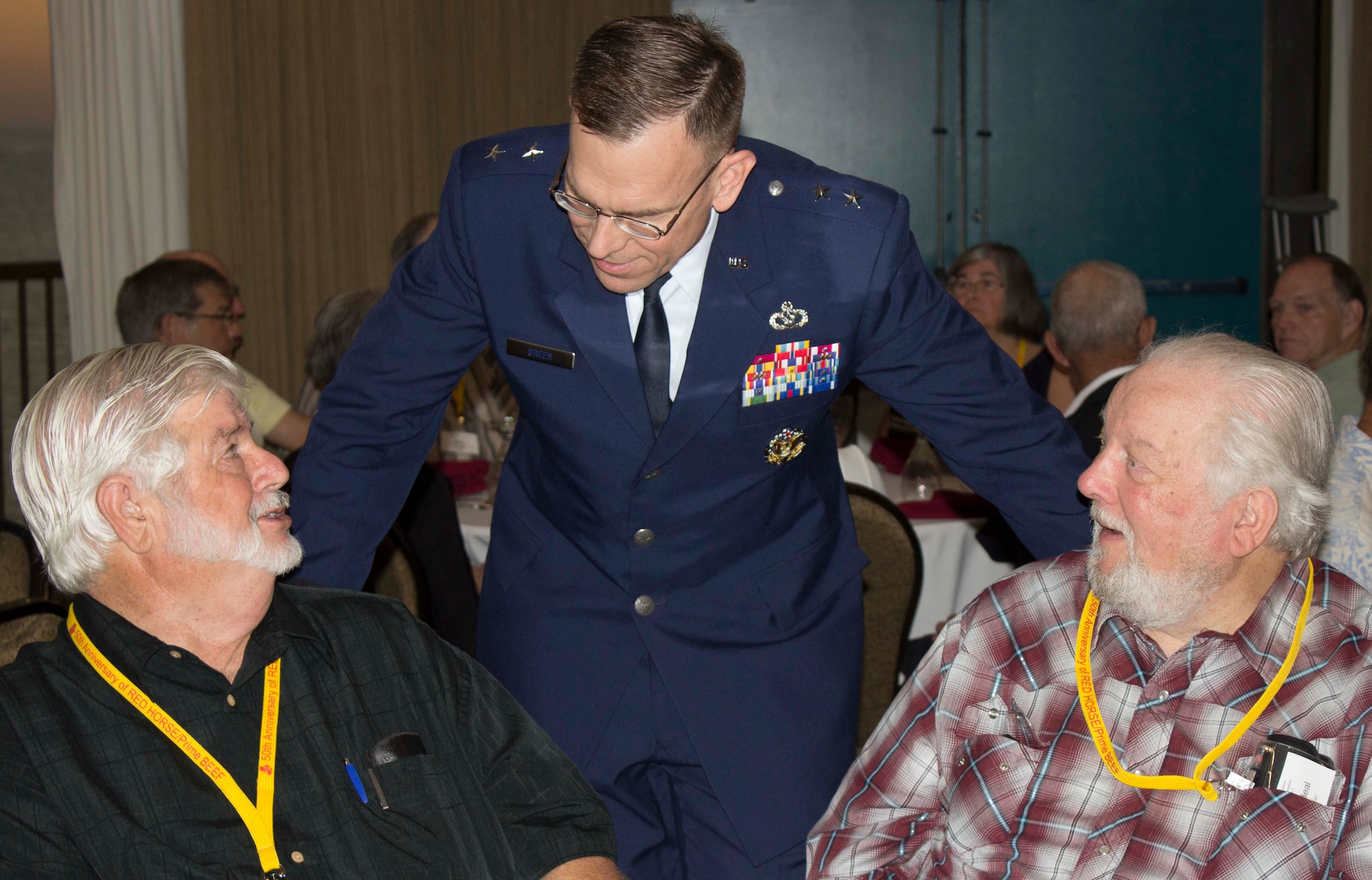 At center, Maj. Gen. Timothy Green greets attendees prior to delivering the keynote address at a banquet held during the RED HORSE Association’s 50th anniversary convention in Fort Walton Beach, Florida.  (U.S. Air Force Photo/Mekka Parish/Released)