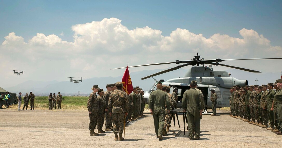 Two MV-22B Ospreys with Joint Task Force 505 return from delivering relief supplies to Jiri Village during the dignified transfer of six U.S. Marines and two Nepalese soldiers at Tribhuvan International Airport in Kathmandu, Nepal, May 17. JTF 505 conducting Operation Sahayogi Haat continues to honor their fallen service members by carrying on with their original humanitarian aid mission to help Nepalese civilians still suffering from 7.8 and 7.3 magnitude earthquakes that struck the region April 25 and May 12, respectively.