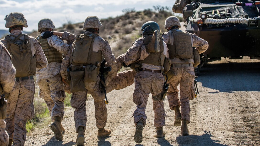 Marines with 4th Light Armored Reconnaissance Battalion, 4th Marine Division, simulate a casualty evacuation during exercise Trident Juncture 2015 in Almería, Spain, Oct. 31, 2015. The exercise provided an opportunity for Reserve Marines to gain experience within their military occupational specialty and demonstrates their readiness in conjunction with other foreign nationals.