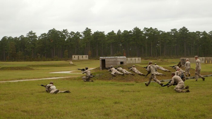 Marines with 1st Battalion, 6th Marine Regiment, assault an objective during a platoon-reinforced attack at Marine Corps Base Camp Lejeune, N.C., Oct. 28, 2015. “What I truly hope my Marines take from this training is that they build that implicit communication and that mutual trust between each other. I want them to know the Marines on the support by fire position are covering them so the Marines in the assault know they are able to lean into those fires in order to stay covered while destroying the enemy on the objective,” said 1st Lt. Mark Dela Pena, a platoon commander with the unit. The battalion is conducting this training in order to prepare for their upcoming deployment on the 22nd Marine Expeditionary Unit next year. 