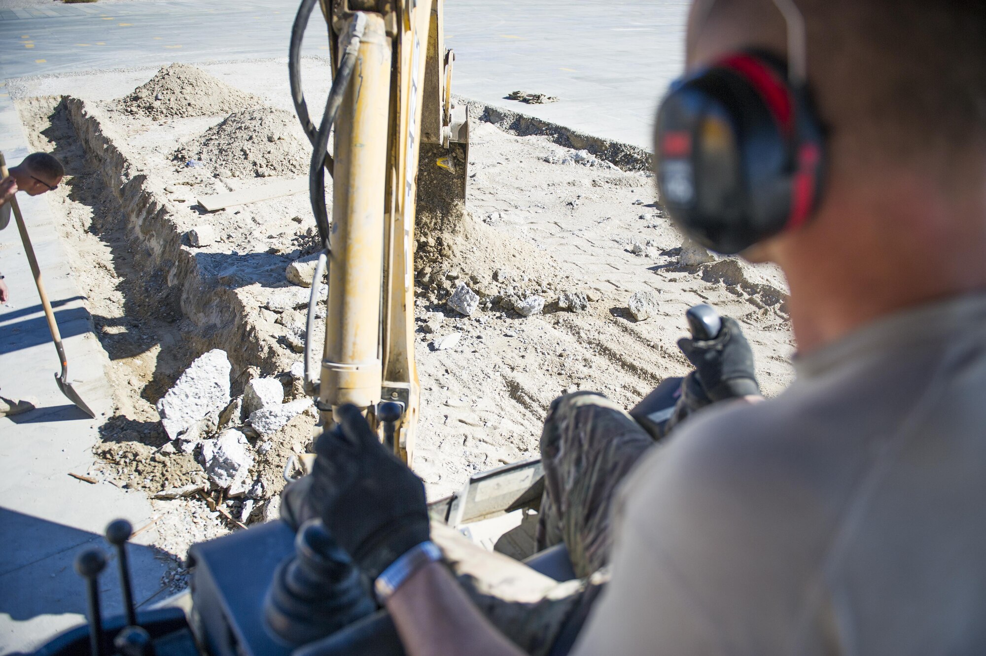 Tech. Sgt. David Blankenship, 455th Expeditionary Civil Engineer Squadron pavements and equipment technician, deployed from the 2nd CES at Barksdale Air Force Base, La., operates a backhoe at Bagram Airfield, Afghanistan, Nov. 4, 2015. The 455th ECES "Dirt Boys" prepared an area for cement in support of a large-area maintenance structure slated for construction in the next few months.(U.S. Air Force photo by Tech. Sgt. Robert Cloys/RELEASED)