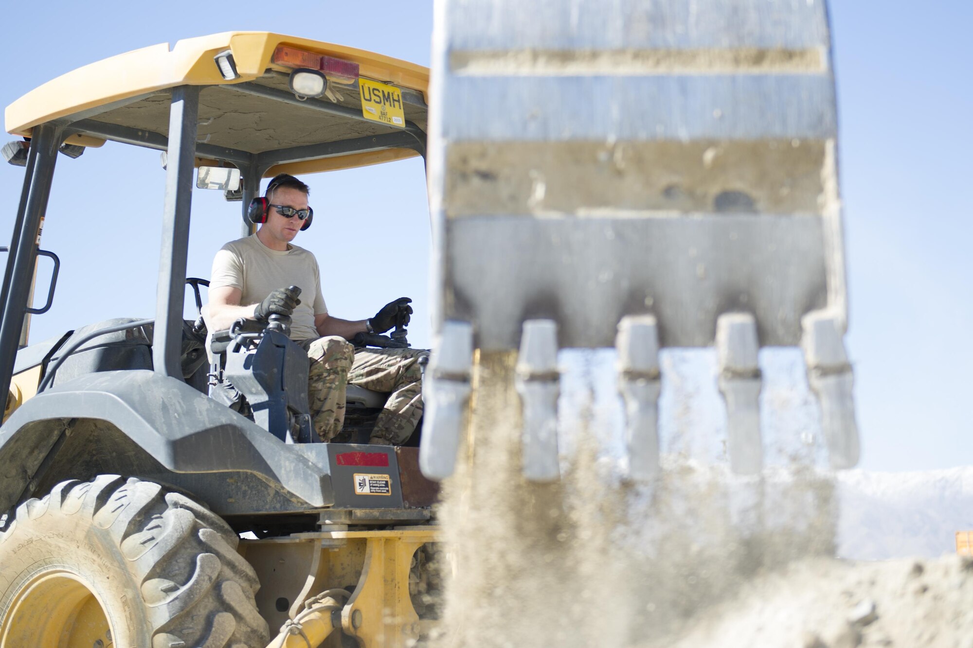 Tech. Sgt. David Blankenship, 455th Expeditionary Civil Engineer Squadron pavements and equipment technician, deployed from the 2nd CES at Barksdale Air Force Base, La., operates a backhoe at Bagram Airfield, Afghanistan, Nov. 4, 2015. The 455th ECES "Dirt Boys" prepared an area for cement in support of a large-area maintenance structure slated for construction in the next few months.(U.S. Air Force photo by Tech. Sgt. Robert Cloys/RELEASED)