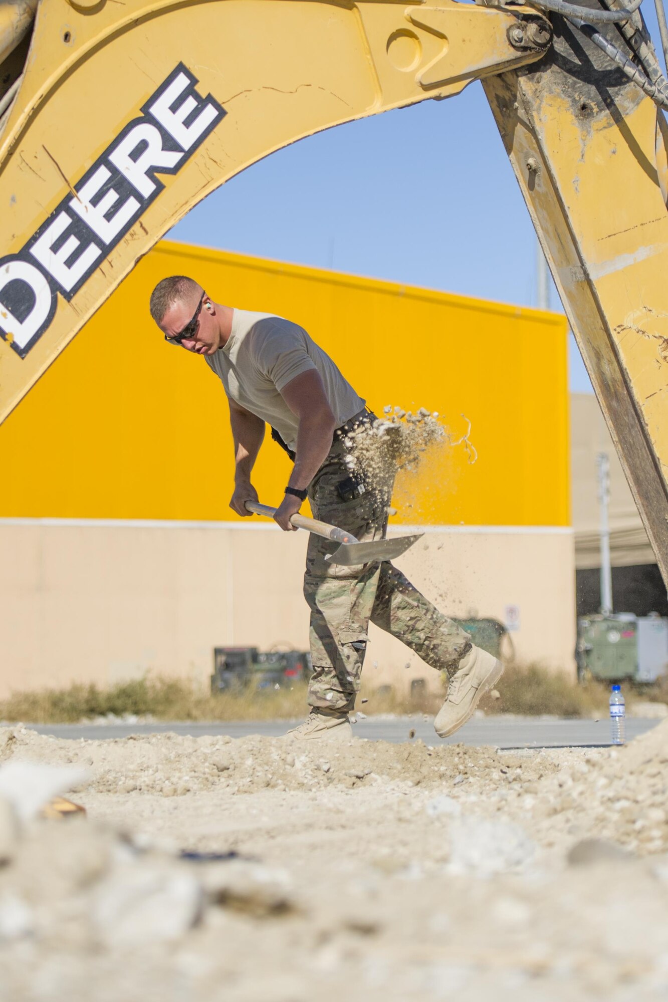 Airman 1st Class Patrick Chuba, 455th Expeditionary Civil Engineer Squadron pavements and equipment technician,  deployed from Barksdale Air Force Base, La., removes excess dirt at a construction site in Bagram Airfield, Afghanistan, Nov. 4, 2015. The 455th ECES "Dirt Boys" prepared an area for cement in support of large area maintenance structure slated for construction in the next few months.(U.S. Air Force photo by Tech. Sgt. Robert Cloys/RELEASED)