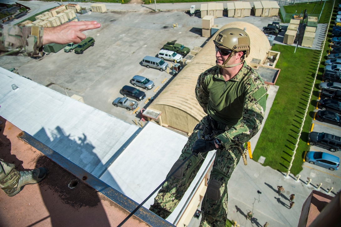 A sailor prepares to conduct helicopter rope suspension technique training on Naval Base Guam, Oct. 29, 2015. U.S. Navy photo by Petty Officer 2nd Class Daniel Rolston