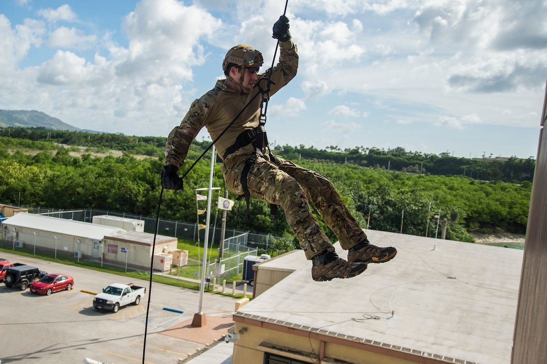 A sailor conducts rope-suspension technique training on Naval Base Guam, Oct. 29, 2015. U.S. Navy photo by Petty Officer 2nd Class Daniel Rolston