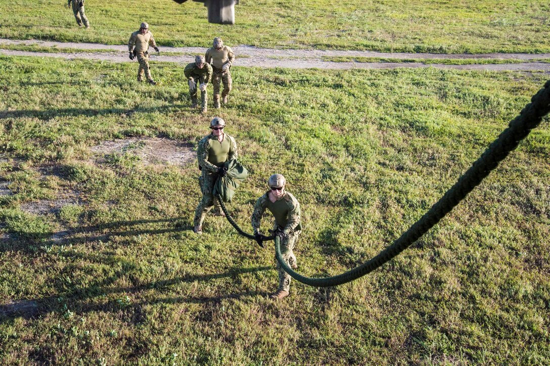 Sailors conduct helicopter rope-suspension technique training from a MH-60S Sea Hawk helicopter on Naval Base Guam, Oct. 29, 2015. U.S. Navy photo by Petty Officer 2nd Class Daniel Rolston