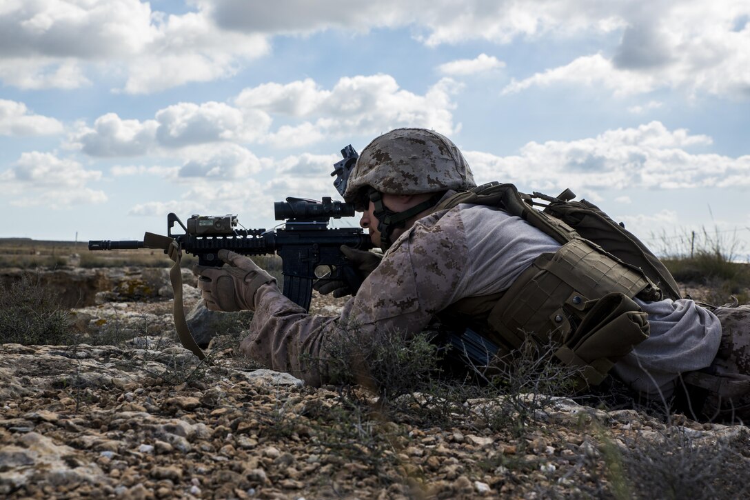 Sgt. Duane A. Peppel, scout team leader 4th Light Armored Reconnaissance Battalion, 4th Marine Division, scans the horizon during the final stages of exercise Trident Juncture 15 in Almería Spain, Oct. 28, 2015. The simulated training taught the Marines each other’s strengths and weaknesses, allowing them to seek improvement as well as build interoperability among the warfighters.