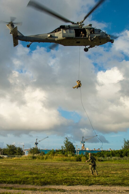 Sailors conduct helicopter rope-suspension technique training from a MH-60S Sea Hawk helicopter on Naval Base Guam, Oct. 29, 2015. U.S. Navy photo by Petty Officer 2nd Class Daniel Rolston 