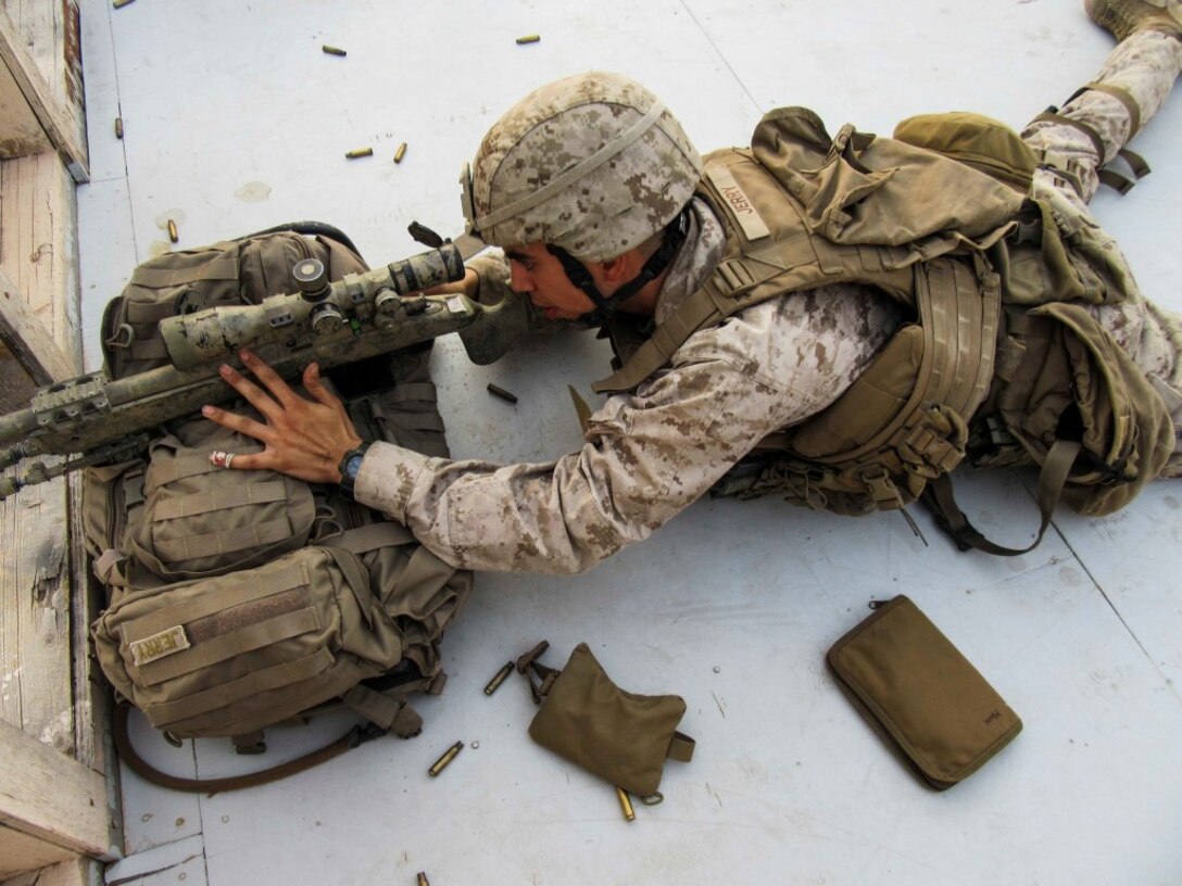 KUWAIT (Aug. 25, 2015) U.S. Marine Cpl. Mark Jerry fires an M40A5 sniper rifle during sustainment training. Jerry is a scout sniper with Weapons Company, Battalion Landing Team 3rd Battalion, 1st Marine Regiment, 15th Marine Expeditionary Unit. The Marines also practiced shooting and communicating while bounding in between barricades. (U.S. Marine Corps courtesy photo/Released)