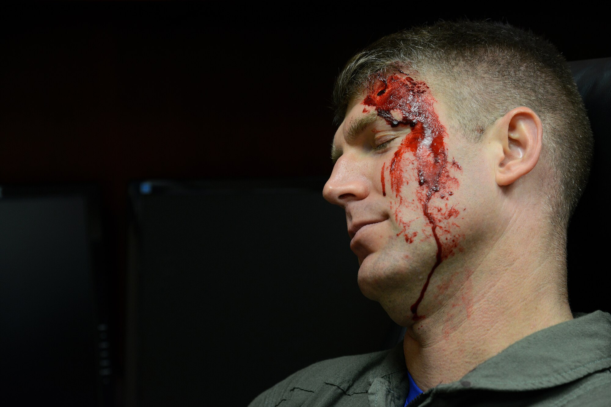 Lt. Col. Gregory Soderstrom, 47th Student Squadron commander, plays dead during an exercise on Laughlin Air Force Base, Texas, Oct. 30, 2015. Role players, a critical asset in a training environment, provide a freethinking, adaptive, capabilities-based force to act as "cast members" during active component training events, helping to create a realistic and unique experience. (U.S. Air Force photo by Airman 1st Class Ariel D. Partlow)(Released)