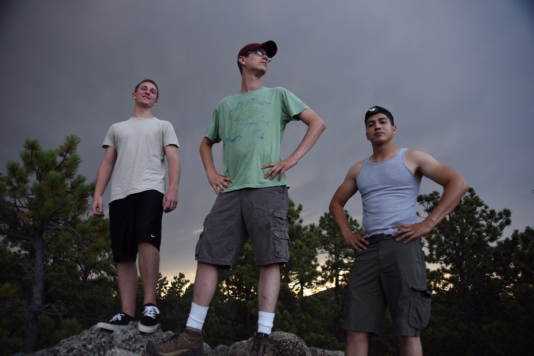 28th Comptroller Squadron members, from left, Air Force Airman 1st Class Matt Hinson, a financial customer service technician, Air Force Staff Sgt. William Johnson, unit deployment manager, and Air Force Airman 1st Class Fabian Miranda-Corpuz, a budget analyst, pose after conquering the climb to the top of a rock formation at Custer State Park, S.D., July 24, 2015. Hiking is one way Hinson and his co-workers relax and bond outside of work. U.S. Air Force photo by Airman 1st Class James L. Miller