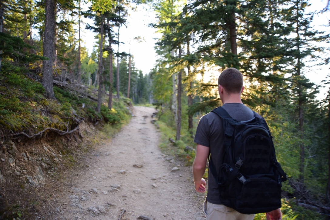Air Force Airman 1st Class Matt Hinson, a financial customer service technician with the 28th Comptroller Squadron, hikes down the No.4 Harney Peak trail in Black Hills National Forest, S.D., Sept. 12, 2015. Hinson uses hiking as a way to relax and recuperate from work and enjoy the outdoors before the winter arrives. U.S. Air Force photo by Airman 1st Class James L. Miller