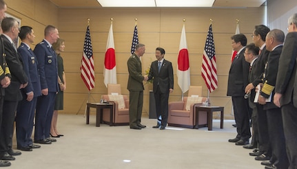 U.S. Marine Corps Gen. Joseph F. Dunford Jr., chairman of the Joint Chiefs of Staff, shakes hands with Japanese Prime Minister Shinzo Abe as they meet at his official residence in Tokyo, Nov. 4, 2015. DoD photo by U.S. Navy Petty Officer 2nd Class Dominique A. Pineiro