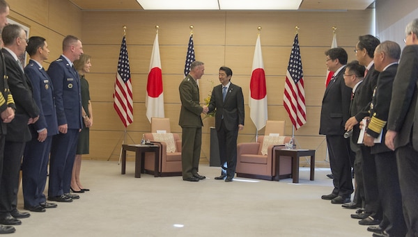 U.S. Marine Corps Gen. Joseph F. Dunford Jr., chairman of the Joint Chiefs of Staff, shakes hands with Japanese Prime Minister Shinzo Abe as they meet at his official residence in Tokyo, Nov. 4, 2015. DoD photo by U.S. Navy Petty Officer 2nd Class Dominique A. Pineiro