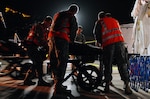 National Guard members of the 270th Military Police Company from the California National Guard prepare to transport a role-play victim from a decontamination tent to medical triage after a simulated nuclear explosion during Vigilant Guard here, Nov. 4. Vigilant Guard is a three-day practical exercise, simulating an improvised nuclear device detonating, and evaluates military and civilian agency cooperation and communication in a time of disaster.