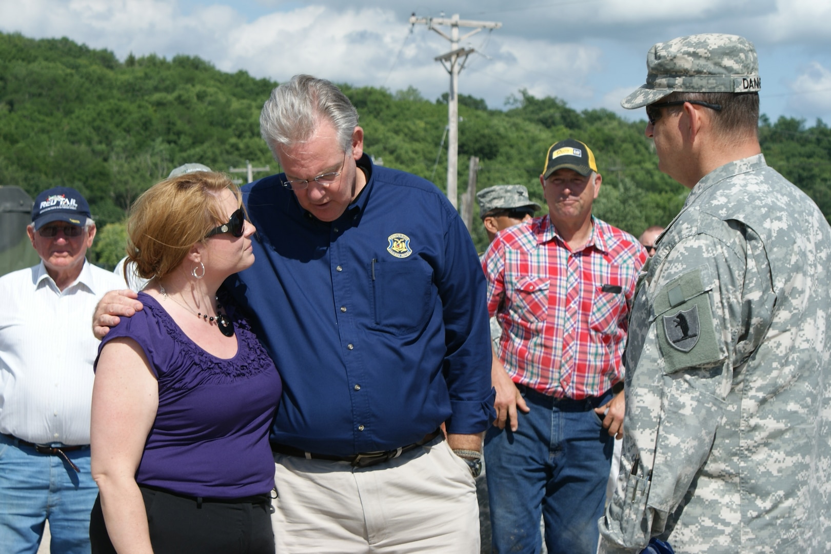 Standing on a bridge on Holt County Rd. 290, Kathy Kunkel, Holt County Clerk, gave a first-hand account to Gov. Jay Nixon and Army Maj. Gen. Stephen Danner, adjutant general of the Missouri National Guard, of the devastation and destruction local citizens faced from the rising flood waters. The Missouri River broke through levees just six miles to the west and filled the basin with eight feet of water in a mere 48 hours.