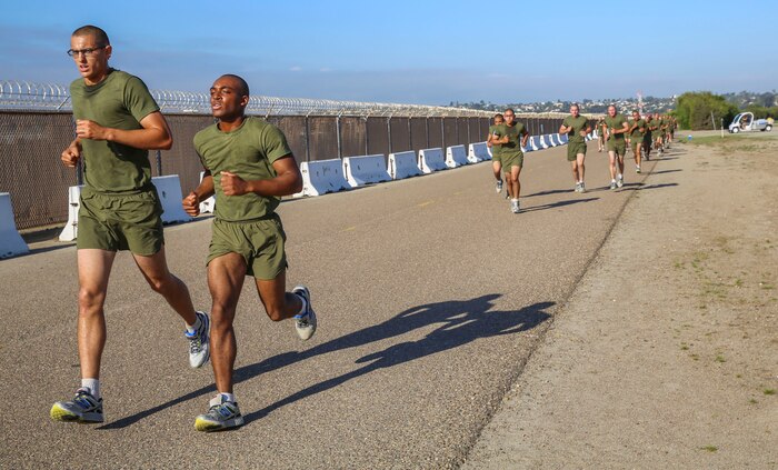 Recruits of India Company, 3rd Recruit Training Battalion, conduct a three-mile run during a final physical fitness test at Marine Corps Recruit Depot San Diego, Oct. 22. To achieve a perfect score of 300, recruits must run three miles in 18 minutes, complete 100 crunches in two minutes and conduct 20 dead hang pull-ups. Today, all males recruited from west of the Mississippi are trained at MCRD San Diego. The depot is responsible for training more than 16,000 recruits annually. India Company graduates Nov. 6.
