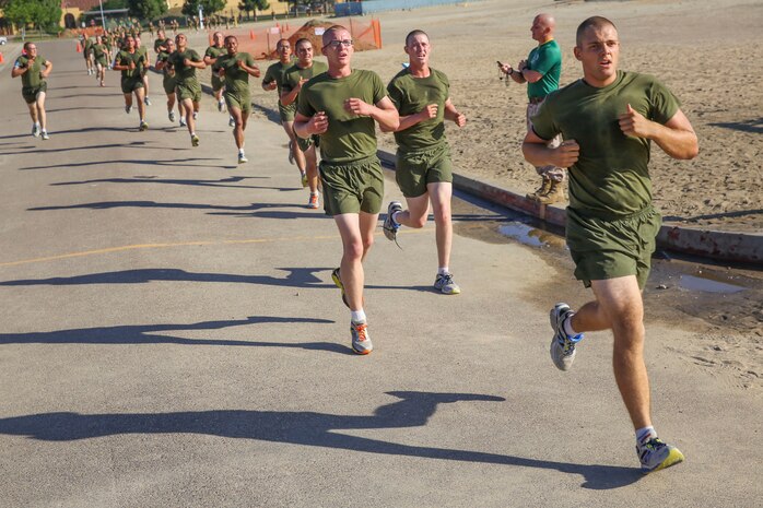 Recruits of India Company, 3rd Recruit Training Battalion, finish a three-mile run during a final physical fitness test at Marine Corps Recruit Depot San Diego, Oct. 22. The recruits took an initial test in week five of training and compared their final results with their initial results to see how much they improved. Today, all males recruited from west of the Mississippi are trained at MCRD San Diego. The depot is responsible for training more than 16,000 recruits annually. India Company graduates Nov. 6.