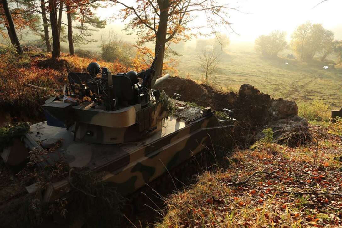 U.S. soldiers act as opposing forces and man a Panzer M113 A3/OSV-MBT while providing security from an operational post during Exercise Combined Resolve V at the Joint Multinational Readiness Center in Hohenfels, Germany, Oct. 31, 2015. The soldiers are assigned to 1st Battalion, 4th Infantry Regiment. U.S. Army photo by Spc. John Cress Jr.