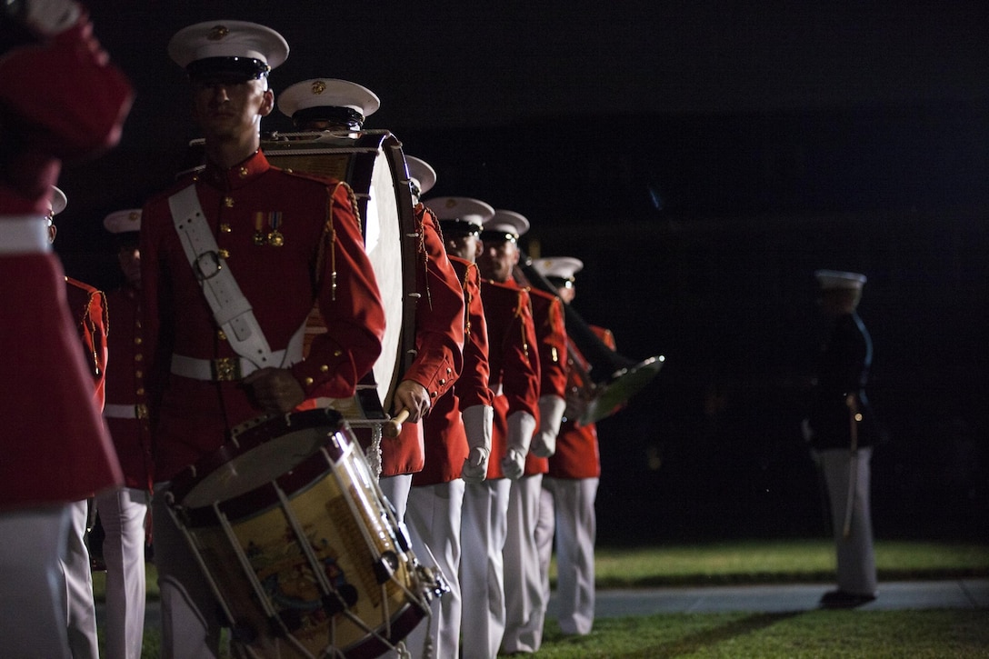 The "Field Crew" element of the The United States Marine Drum & Bugle Corps consists of 36 Marines. Highlighted by the thunderous sounds of the traditional rope tension drums, their contribution of the musical entertainment is always a crowd favorite.