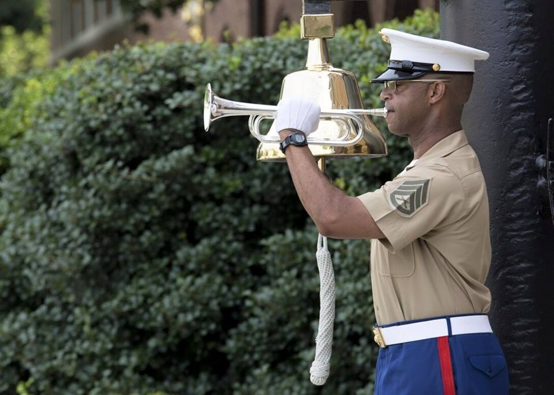 Soprano bugler, Staff Sergeant Michael Coleman, performs "To The Colors" and strikes "8 Bells" during the Morning Colors Ceremonial Sequence. Marine Barracks Washington is the only post in the corps that continues the tradition of live bugle calls. (Official Marine Corps photo by Cpl. Chi Nguyen/Released)