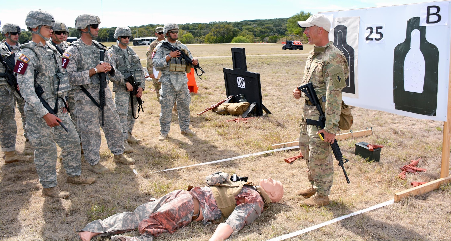 Soldiers competing in the 2015 Army Best Medic Competition receive a briefing about the maneuvers required to execute the Combat Stress Shoot  events at Camp Bullis. The competition took place from Oct. 27 through Friday.