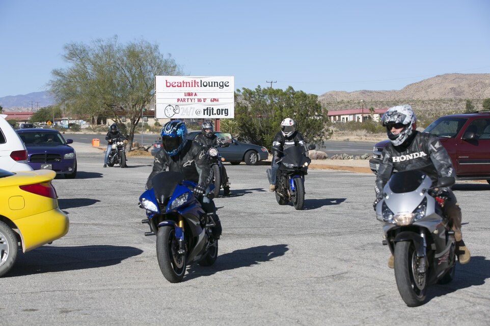 Motorcycle riders from Marine Wing Support Squadron 374 pull into the Joshua Tree Unity Home during the Family Advocacy Program’s second annual Domestic Violence Awareness Poker Run Style Motorcycle Ride, Oct. 30, 2015. The riders learned how the Unity Home helps people who have suffered from domestic violence. (Official Marine Corps photo by Lance Cpl. Thomas Mudd/Released)