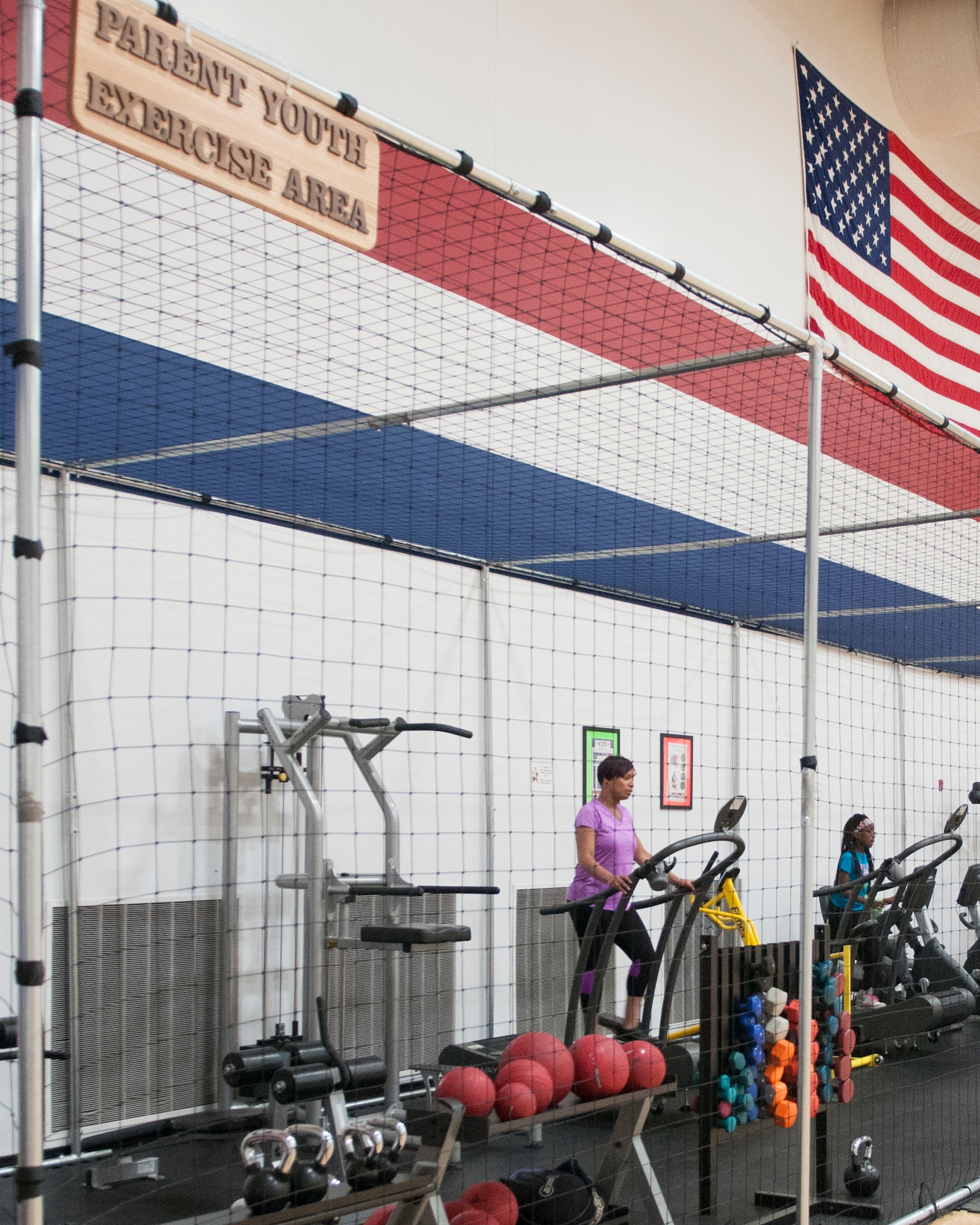 Patrons use the Parent Youth Fitness Area, Oct. 28, 2015, in Freedom Hall Fitness Center on F.E. Warren Air Force Base, Wyo. The fitness center recently opened the new area following the eight-month long project to give Airmen and their families more options for exercising. (U.S. Air Force photo by Airman 1st Class Malcolm Mayfield)