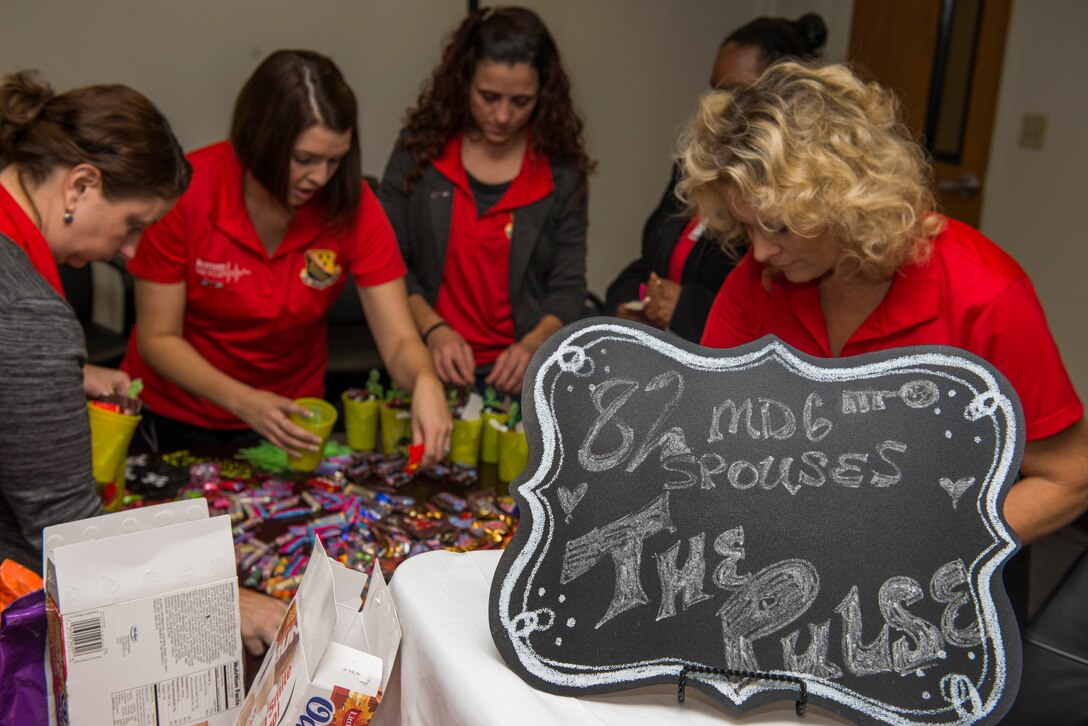 82nd Medical Group Key Spouses fill gift bags for Airmen that live in the MDG dorms at Sheppard Air Force Base, Texas, Oct. 27, 2015. The Key Spouse program is a formal commander driven unit and family program with the mission to enhance readiness and establish a sense of Air Force community. (U.S. Air Force photo/Senior Airman Kyle Gese)