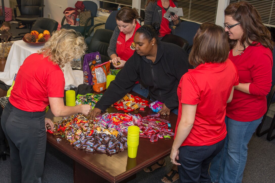 82nd Medical Group Key Spouses fill gift bags for Airmen that live in the MDG dorms at Sheppard Air Force Base, Texas, Oct. 27, 2015. The Key Spouse program is a formal commander driven unit and family program with the mission to enhance readiness and establish a sense of Air Force community. (U.S. Air Force photo/Senior Airman Kyle Gese)