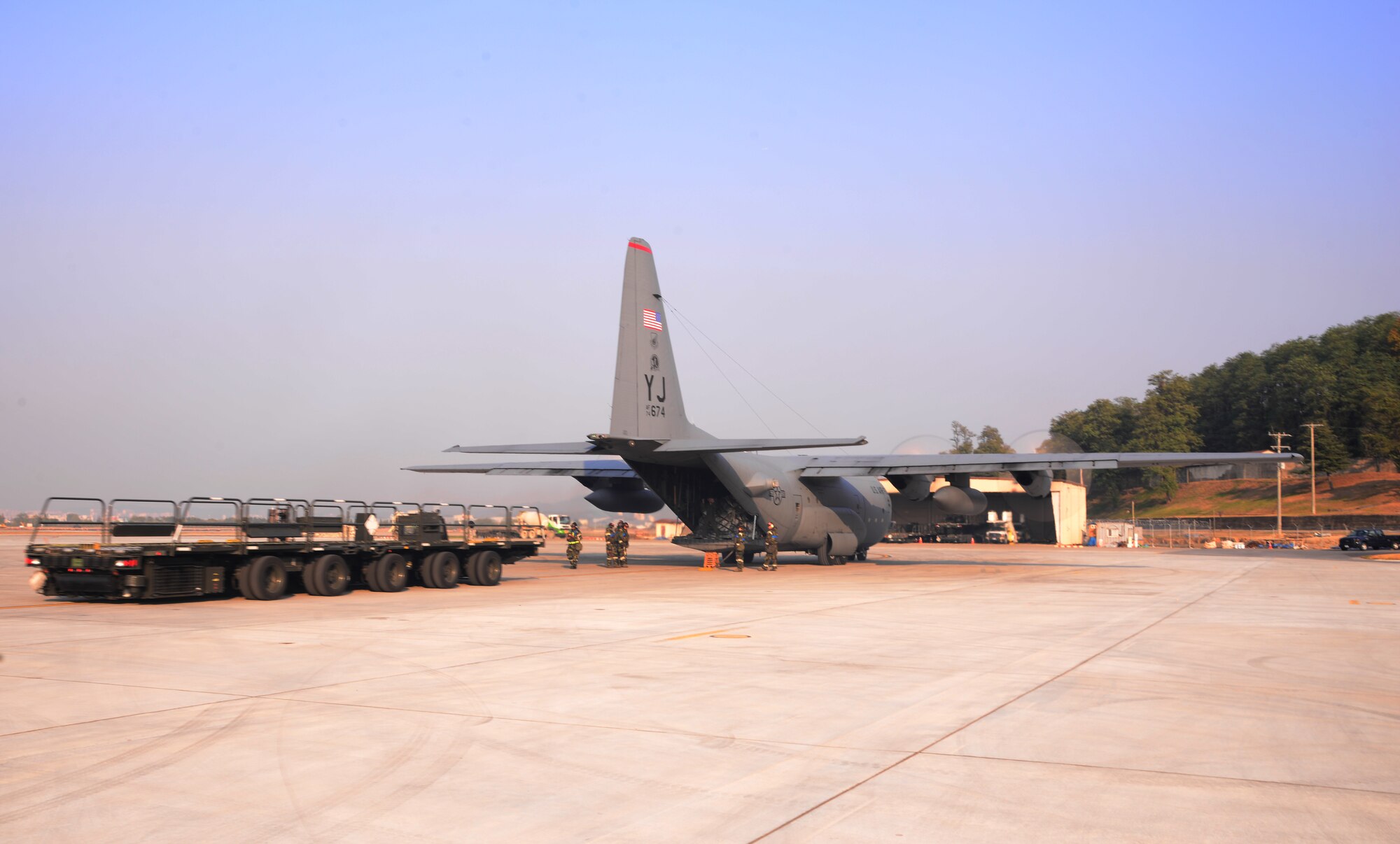 Airmen assigned to the 731st Air Mobility Squadron prepare to perform a running offload of a C-130 Hercules from Yokota Air Base, Japan, Nov. 3, 2015, at Osan Air Base, Republic of Korea. Nearly every member participating in the readiness exercise Vigilant Ace 16 passed through the area of responsibility assigned to the 731st AMS. Vigilant Ace 16 is a large-scale exercise designed to enhance combat capabilities and interoperability of the U.S. and Republic of Korea Air Forces. (U.S. Air Force photo/Staff Sgt. Benjamin Sutton)