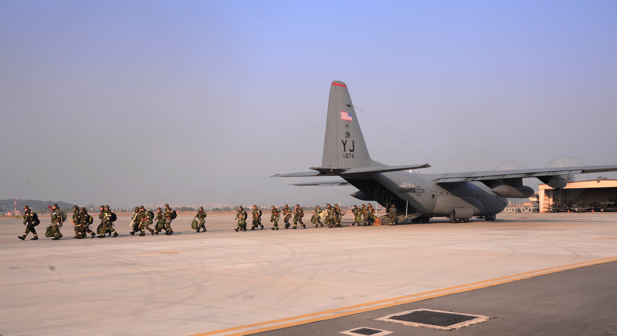 Airmen from Misawa Air Base, Japan, offload a running C-130 Hercules from Yokota Air Base, Japan, Nov. 3, 2015, at Osan Air Base, Republic of Korea. Many bases from the Pacific Air Forces are participating in the readiness exercise Vigilant Ace 16. Vigilant Ace 16 is a large-scale exercise designed to enhance combat capabilities and interoperability of the U.S. and Republic of Korea Air Forces. (U.S. Air Force photo/Staff Sgt. Benjamin Sutton)