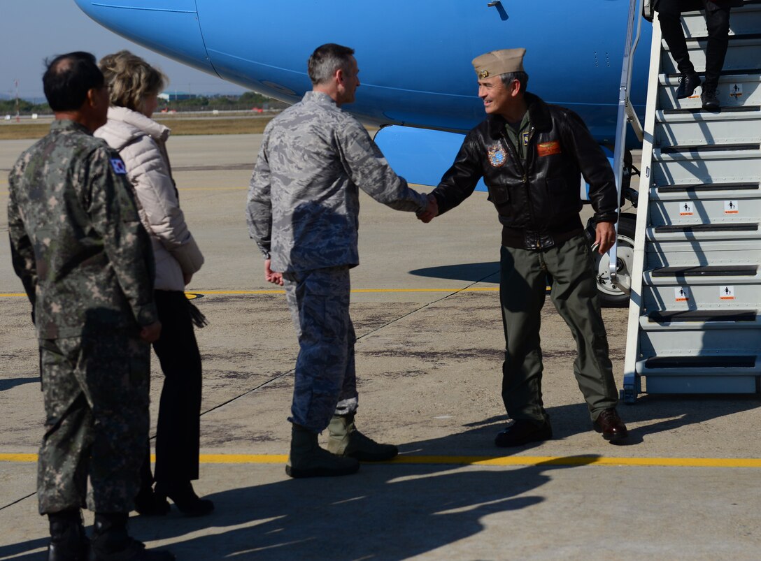 U.S. Navy Adm. Harry B. Harris Jr., U.S. Pacific Command commander, greets Lt. Gen. Terrence J. O'Shaughnessy, 7th Air Force commander, at Osan Air Base, Republic of Korea, Oct. 31, 2015. Harris’s visit coincided with senior-level, bilateral defense talks between the U.S. and ROK at the 40th Military Committee Meeting and the 47th Security Consultative Meeting held in Seoul, Nov. 1 and 2, respectively. After his arrival, Harris immediately inspected dormitory 708, meeting Airmen dorm residents and discussing the status of the living facilities. (U.S. Air Force photo/Staff Sgt. Amber Grimm)