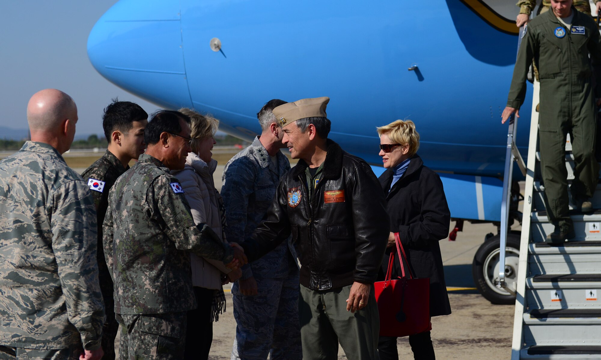 U.S. Navy Adm. Harry B. Harris Jr., U.S. Pacific Command commander, shakes the hand of Republic of Korea air force Lt. Gen. Lee, Wang-geun, Air Force Operations commander, on arrival to Osan Air Base, Republic of Korea, Oct. 31, 2015. Harris attended the 2015 Military Committee and Security Consultative meetings in Seoul where leaders evaluate potential military threats and discuss ways to cooperate against provocations. After his arrival, Harris immediately inspected dormitory 708, meeting Airmen dorm residents and discussing the status of the living facilities. (U.S. Air Force photo/Staff Sgt. Amber Grimm)