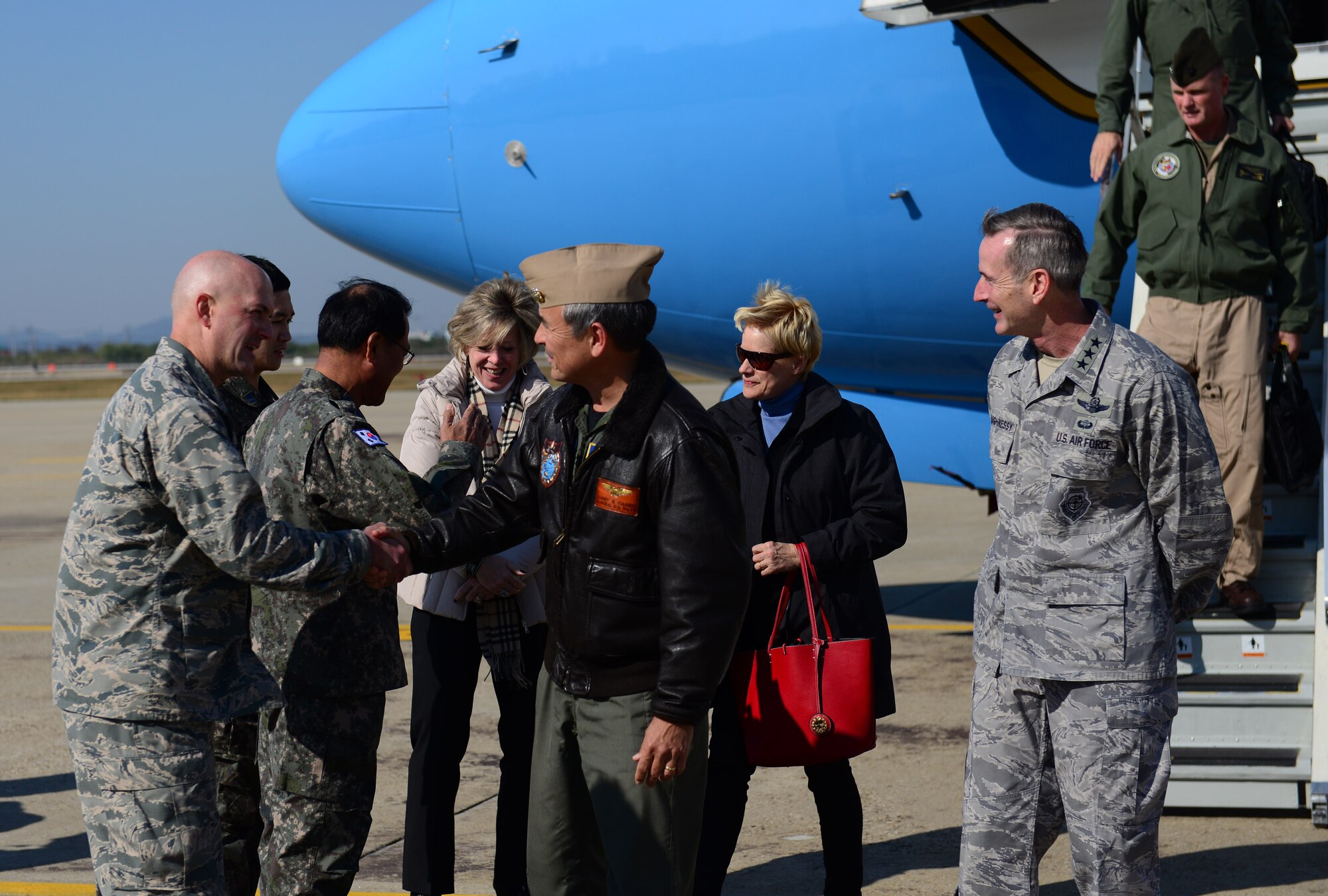 U.S. Navy Adm. Harry B. Harris Jr., U.S. Pacific Command commander, shakes the hand of Col. Andrew Hansen, 51st Fighter Wing commander, upon his arrival to Osan Air Base, Republic of Korea, Oct. 31, 2015. After his arrival, Harris inspected dormitory 708 and met with residents and dorm leaders. During the visit, Harris discussed the status of the living facilities and the quality of life with several Airmen. (U.S. Air Force photo/Staff Sgt. Amber Grimm)