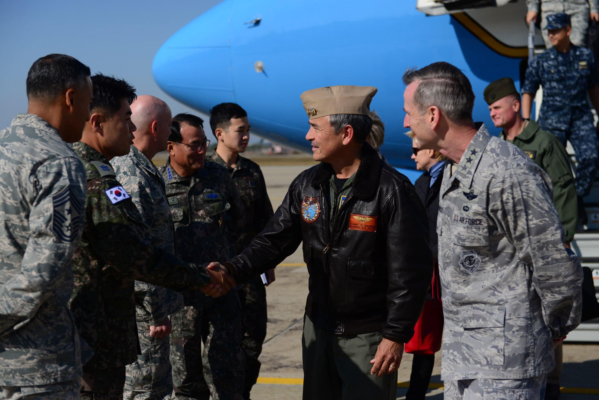 U.S. Navy Adm. Harry B. Harris Jr., U.S. Pacific Command commander, is met by U.S. and ROK senior leaders at Osan Air Base, Republic of Korea, Oct. 31, 2015. During his visit, Harris was individually briefed on the conditions of Osan’s dormitories, before inspecting one himself. In addition to this visit, he attended a series of bilateral coordination meetings between ROK and U.S. senior leadership. (U.S. Air Force photo/Staff Sgt. Amber Grimm) 