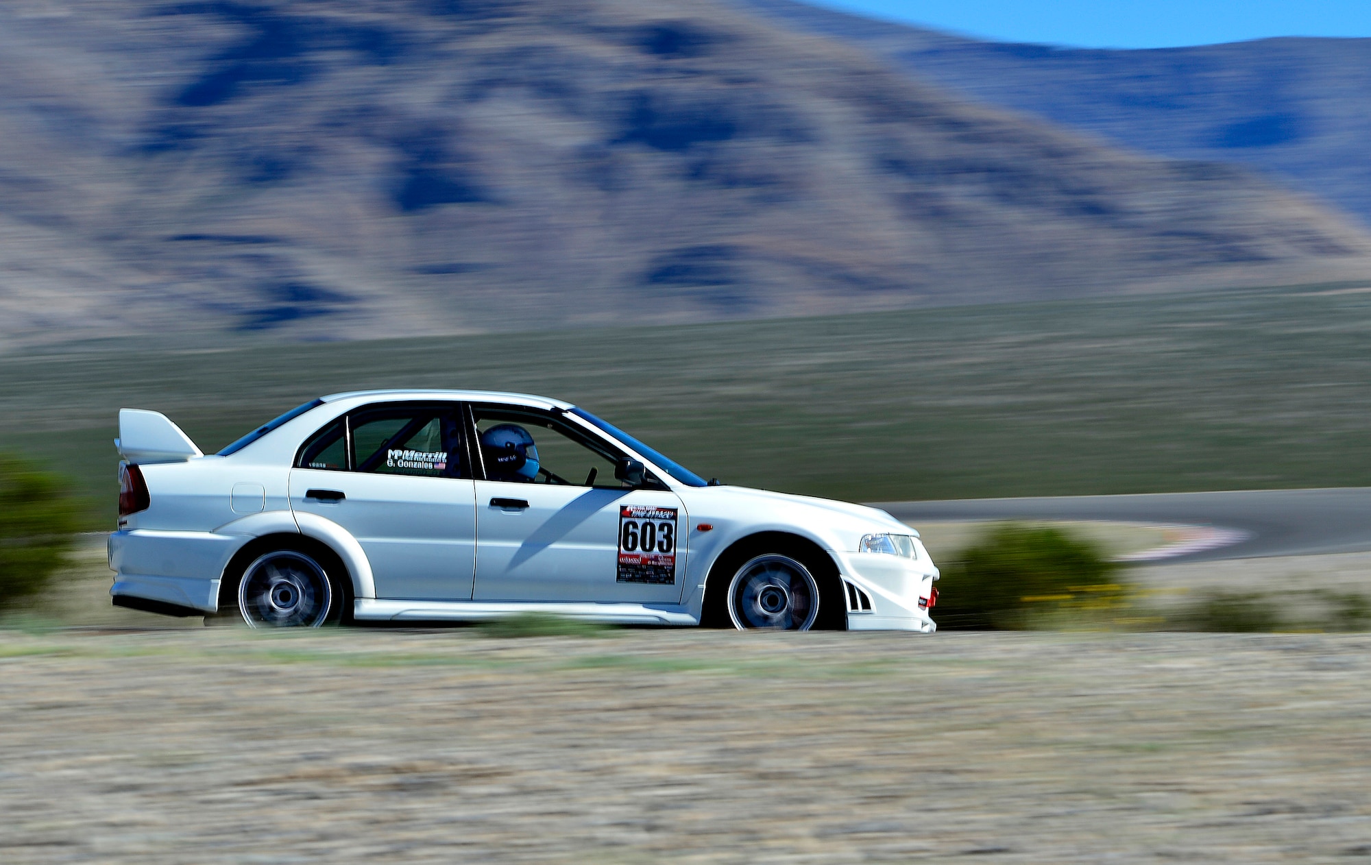 Tech. Sgt. Gabriel, 432nd Wing/432nd Air Expeditionary Wing MQ-9 Reaper sensor operator, races his Mitsubishi Lancer Evolution at the Spring Mountain Raceway Nov. 1, 2015, in Pahrump, Nevada. Gabriel has owned and modified his Evolution for over five years. He's upgraded everything from the engine, suspension, brakes, and safety equipment to compete in time attack style racing. (U.S. Air Force photo by Airman 1st Class Christian Clausen/Released)