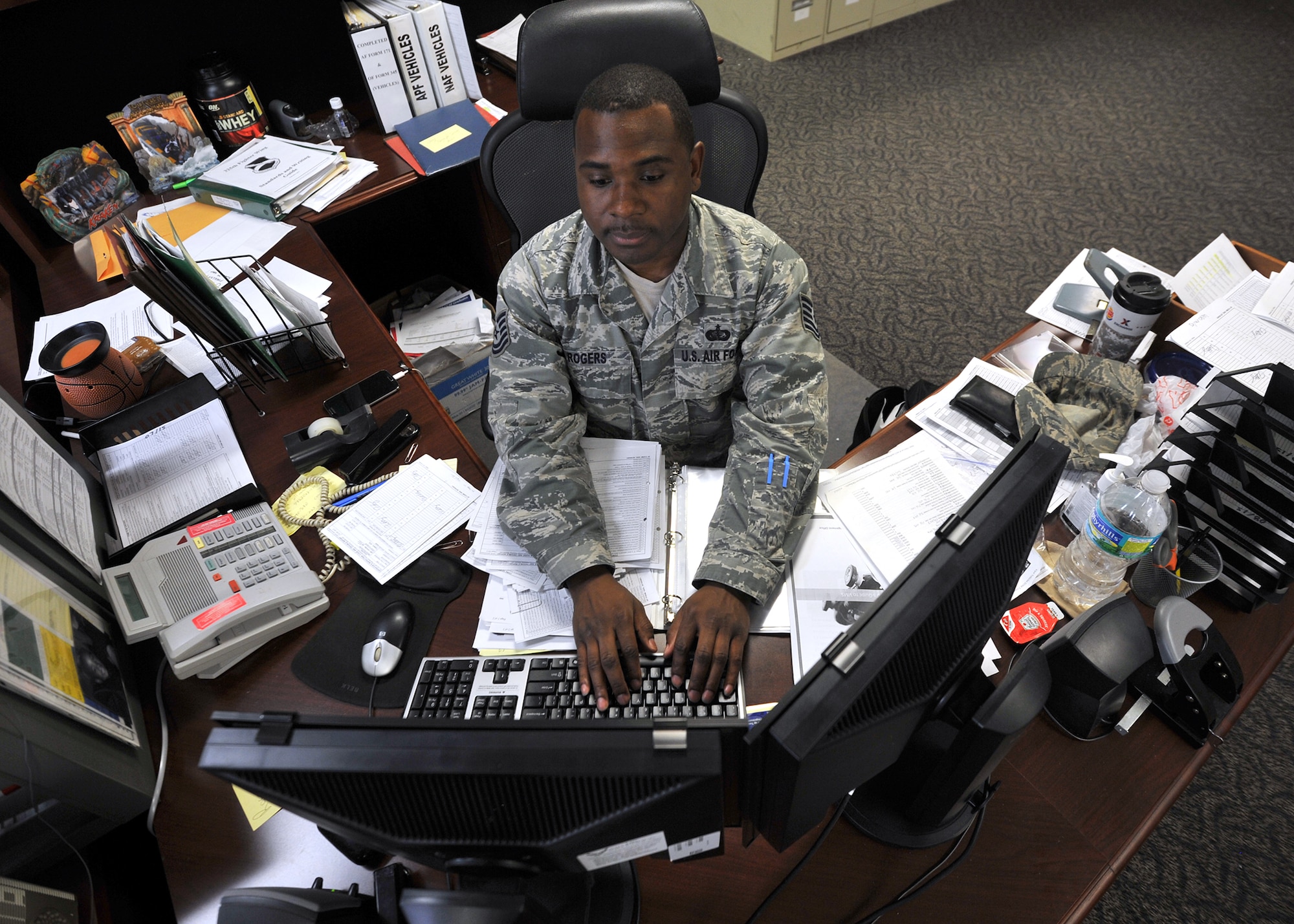 Technical Sgt. Vernon Rogers, 325th Force Support Squadron resource management NCO in-charge, logs and inputs vehicle information at his workstation Oct. 28 at the Military Personnel Section building. As the resource management NCOIC, Rogers is tasked with recording and archiving information for Tyndall’s assets such as government owned vehicles. (U.S. Air Force photo by Senior Airman Ty-Rico Lea/Released)