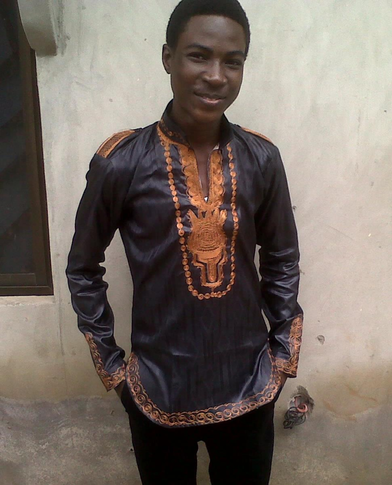 Airman 1st Class Adeola Adeboyejo, 92nd Force Support Squadron outbound assignment technician, poses for a photo with his traditional Nigerian embroidered top in 2011. Adeboyejo was born in Nigeria with a royal bloodline, but moved to the United States in 2013 to further his education. Since he was nine years old, Adeboyejo has been working toward becoming a pilot. (Courtesy Photo)