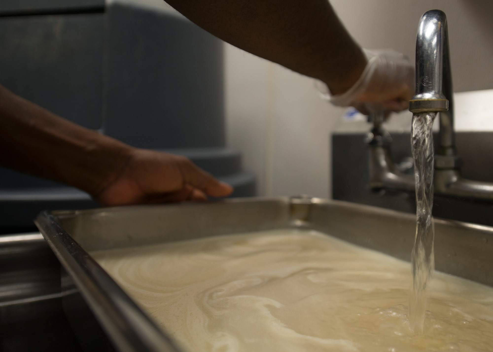 U.S. Air Force Senior Airman Fritz Javel, 633rd Force Support Squadron services journeyman, prepares a meal in the Raptor Café at Langley Air Force Base, Va., Oct. 30, 2015. Javel prepared rice and chicken parmesan for the Café patrons. (U.S. Air Force photo by Staff Sgt. John D. Strong II/Released)