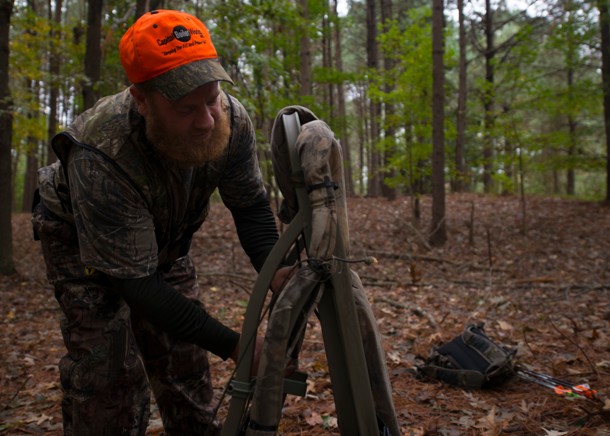Jeremy Liehr, husband of U.S. Army Sergeant First Class Sharon Liehr, configures his tree stand before hunting at the hunting grounds on Fort Eustis, Va., October 28, 2015. A three point safety harness is mandatory in climbing into a tree stand on the Langley Air Force Base and Fort Eustis hunting grounds. (U.S. Air Force photo by Staff Sgt. John D. Strong II) 