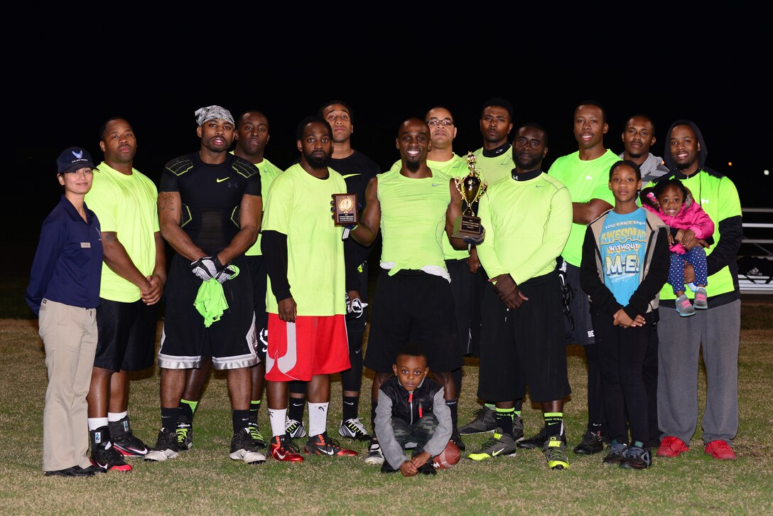 Members of the Ryan Center football team pose for a photo after winning the 2015 Intramural Football Championship at Langley Air Force Base, Va., Nov. 3, 2015. The team defeated the 45th Intelligence Squadron with a score of 20 to 19 in overtime. (U.S. Air Force photo by Senior Airman Kimberly Nagle/Released)