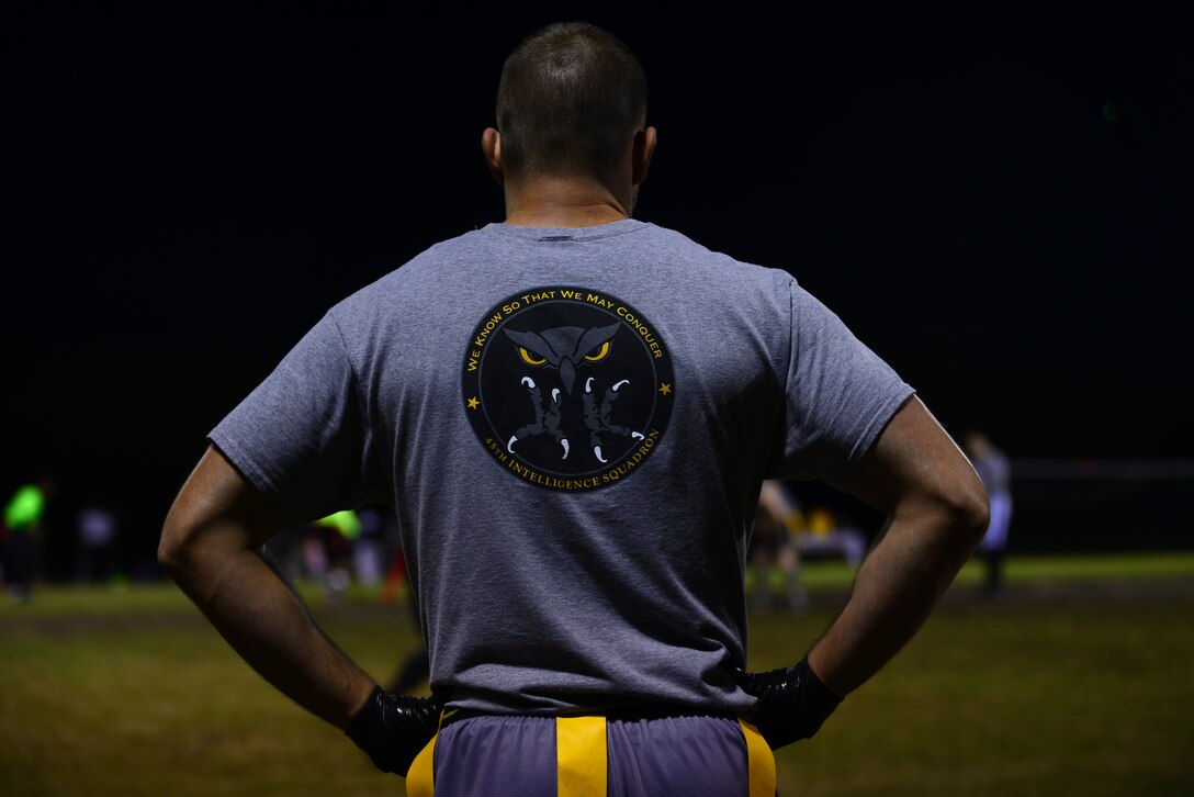 A player with the 45th Intelligence Squadron football team watches the game from the sideline during the 2015 Intramural Football Championship at Langley Air Force Base, Va., Nov. 3, 2015. After starting the football season in late July and competing against 19 other teams throughout the season, the 45th IS came in second place, losing to the Ryan Center in the championship game. (U.S. Air Force Senior Airman Kimberly Nagle/Released)   